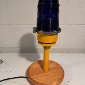 Piston light with a yellow base.